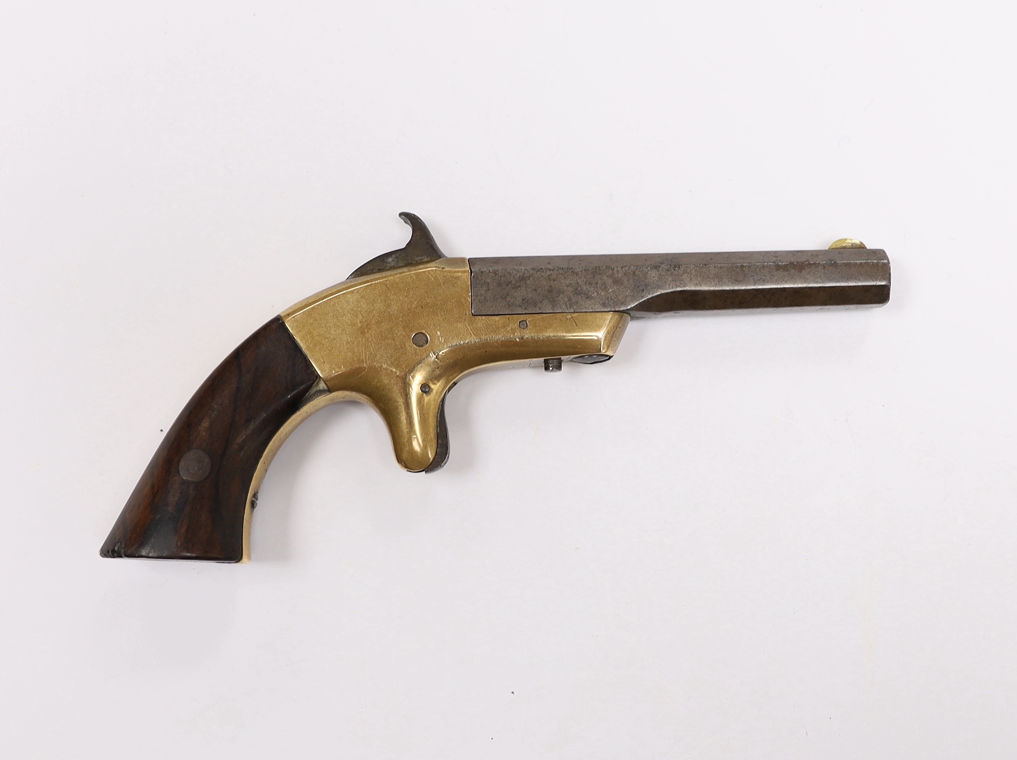 A 19th century miniature percussion pistol with brass lock and octagonal barrel, stamped Morgan and Clapp Newhaven CT, barrel 9cm